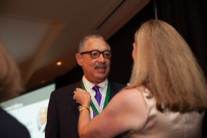 Dr. Cunningham receives his presidential medallion from his wife, Sydney.